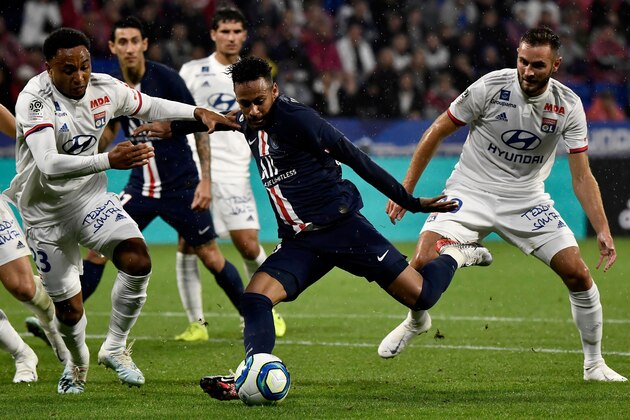 Paris Saint-Germain's Brazilian forward Neymar shoots to score a goal during the French L1 football match between Olympique Lyonnais (OL) and Paris Saint-Germain (PSG) at the Groupama stadium on September 22, 2019 in Decines-Charpieu, near Lyon. (Photo by JEFF PACHOUD / AFP)        (Photo credit should read JEFF PACHOUD/AFP/Getty Images)