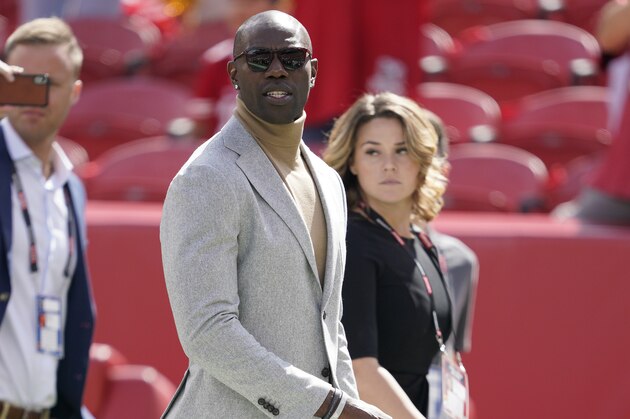 Former San Francisco 49ers wide receiver Terrell Owens walks on the field before an NFL football game between the 49ers and the Pittsburgh Steelers in Santa Clara, Calif., Sunday, Sept. 22, 2019. (AP Photo/Tony Avelar)