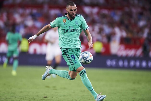 SEVILLE, SPAIN - SEPTEMBER 22:  Karim Benzema of Real Madrid CF in action during the Liga match between Sevilla FC and Real Madrid CF at Estadio Ramon Sanchez Pizjuan on September 22, 2019 in Seville, Spain. (Photo by Aitor Alcalde/Getty Images)