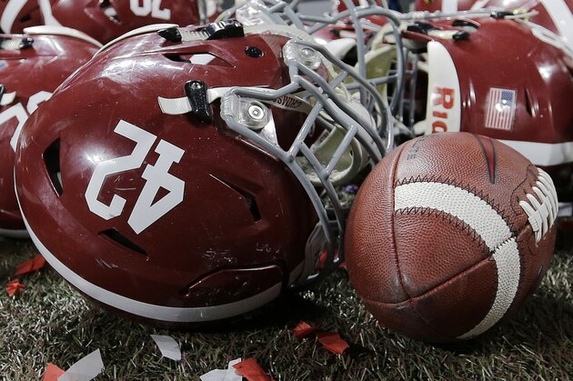 Alabama helmets lay with confetti after overtime of the NCAA college football playoff championship game against Georgia Monday, Jan. 8, 2018, in Atlanta. Alabama won 26-23. (AP Photo/David J. Phillip)