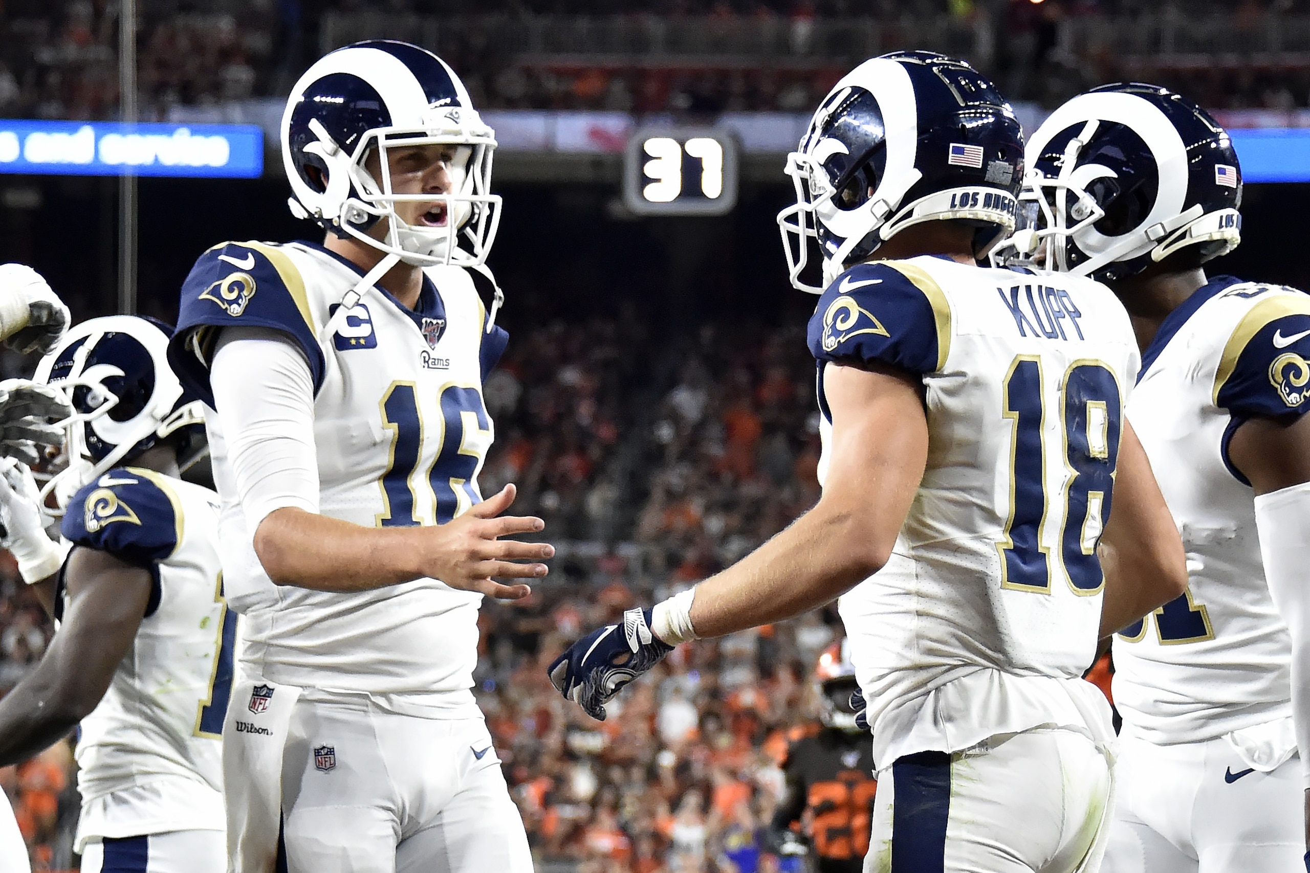 CLEVELAND, OHIO - SEPTEMBER 22: Quarterback Jared Goff #16 celebrates with wide receiver Cooper Kupp #18 of the Los Angeles Rams after the two connected for a touchdown against the Cleveland Browns during the fourth quarter at FirstEnergy Stadium on September 22, 2019 in Cleveland, Ohio. (Photo by Jason Miller/Getty Images) CLEVELAND, OHIO - SEPTEMBER 22: Quarterback Jared Goff #16 celebrates with wide receiver Cooper Kupp #18 of the Los Angeles Rams after the two connected for a touchdown against the Cleveland Browns during the fourth quarter at FirstEnergy Stadium on September 22, 2019 in Cleveland, Ohio. (Photo by Jason Miller/Getty Images)