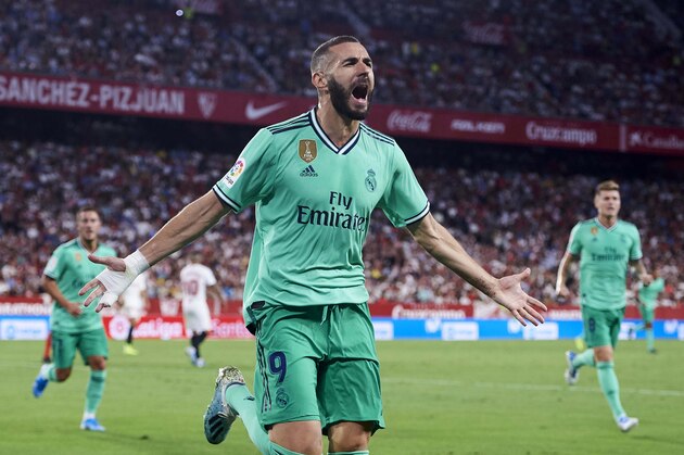SEVILLE, SPAIN - SEPTEMBER 22: Karim Benzema of Real Madrid CF celebrates after scoring a goal during the Liga match between Sevilla FC and Real Madrid CF at Estadio Ramon Sanchez Pizjuan on September 22, 2019 in Seville, Spain. (Photo by Aitor Alcalde/Getty Images)