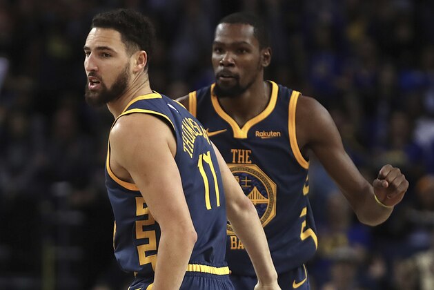 Golden State Warriors' Klay Thompson, left, and Kevin Durant celebrate a score against the Sacramento Kings during the second half of an NBA basketball game Saturday, Nov. 24, 2018, in Oakland, Calif. (AP Photo/Ben Margot) Golden State Warriors' Klay Thompson, left, and Kevin Durant celebrate a score against the Sacramento Kings during the second half of an NBA basketball game Saturday, Nov. 24, 2018, in Oakland, Calif. (AP Photo/Ben Margot)