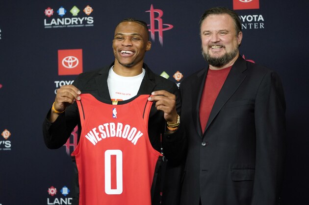 Houston Rockets General Manager Daryl Morey, right, poses with recently acquired guard Russell Westbrook during an NBA basketbll news conference, Friday, July 26, 2019, in Houston. Westbrook was acquired from the Oklahoma City Thunder. (AP Photo/David J. Phillip)