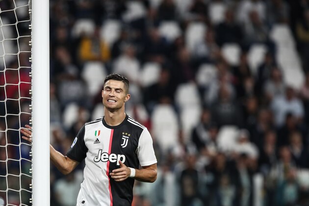 Juventus' Portuguese forward Cristiano Ronaldo reacts after missing a goal opportunity during the Italian Serie A football match Juventus vs Verona on September 21, 2019 at the Juventus stadium in Turin. (Photo by Isabella BONOTTO / AFP)        (Photo credit should read ISABELLA BONOTTO/AFP/Getty Images)