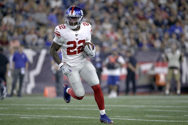 New York Giants running back Wayne Gallman carries the ball in the first half of an NFL preseason football game against the New England Patriots, Thursday, Aug. 29, 2019, in Foxborough, Mass. (AP Photo/Elise Amendola)
