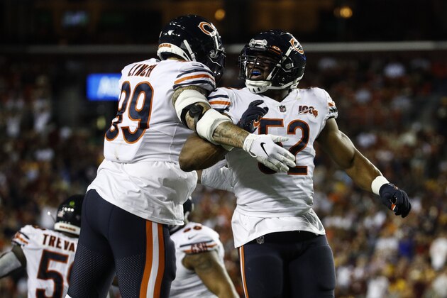 Chicago Bears linebackers Aaron Lynch (99) and Khalil Mack (52) celebrate Mack's hit to cause a fumble by the Washington Redskins during the first half of an NFL football game Monday, Sept. 23, 2019, in Landover, Md. (AP Photo/Patrick Semansky)