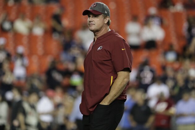 Washington Redskins head coach Jay Gruden stands on the field before an NFL football game against the Chicago Bears, Monday, Sept. 23, 2019, in Landover, Md. (AP Photo/Julio Cortez)