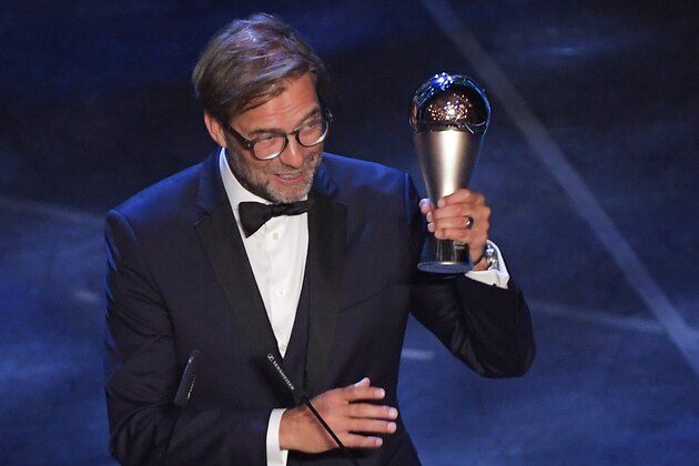 Liverpool coach, Germany's Juergen Klopp reacts after winning the trophy for the Best FIFA Men's Coach of 2019 Award during The Best FIFA Football Awards ceremony, on September 23, 2019 in Milan. (Photo by Marco Bertorello / AFP)        (Photo credit should read MARCO BERTORELLO/AFP/Getty Images)