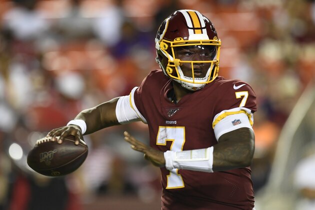 Washington Redskins quarterback Dwayne Haskins looks for an opening during the first half of an NFL preseason football game against the Baltimore Ravens at FedEx Field in Landover, Md., Thursday, Aug. 29, 2019. (AP Photo/Susan Walsh)