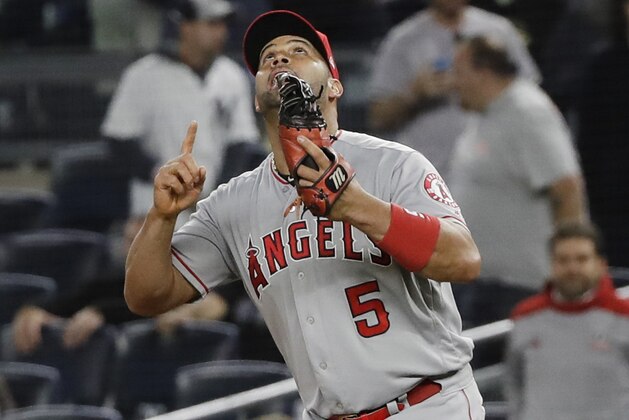 Los Angeles Angels first baseman Albert Pujols celebrates after the Angels' 3-2 win in a baseball game against the New York Yankees on Wednesday, Sept. 18, 2019, in New York. (AP Photo/Frank Franklin II)