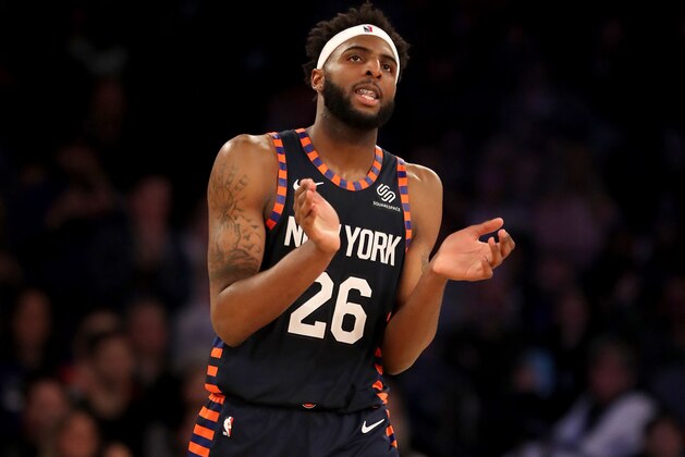 NEW YORK, NEW YORK - APRIL 07:   Mitchell Robinson #26 of the New York Knicks celebrates the win over the Washington Wizards at Madison Square Garden on April 07, 2019 in New York City. The New York Knicks defeated the Washington Wizards 113-110.NOTE TO USER: User expressly acknowledges and agrees that, by downloading and or using this photograph, User is consenting to the terms and conditions of the Getty Images License Agreement. (Photo by Elsa/Getty Images)