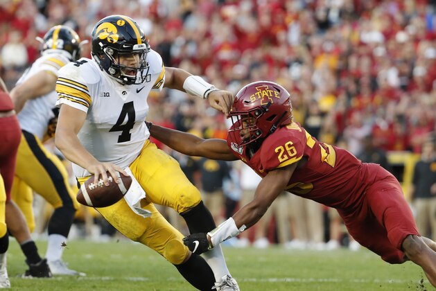 AMES, IA - SEPTEMBER 14: Quarterback Nate Stanley #4 of the Iowa Hawkeyes is tackled by defensive back Anthony Johnson #26 of the Iowa State Cyclones in the first half of play at Jack Trice Stadium on September 14, 2019 in Ames, Iowa. The Iowa Hawkeyes won 18-17 over the Iowa State Cyclones. (Photo by David K Purdy/Getty Images)