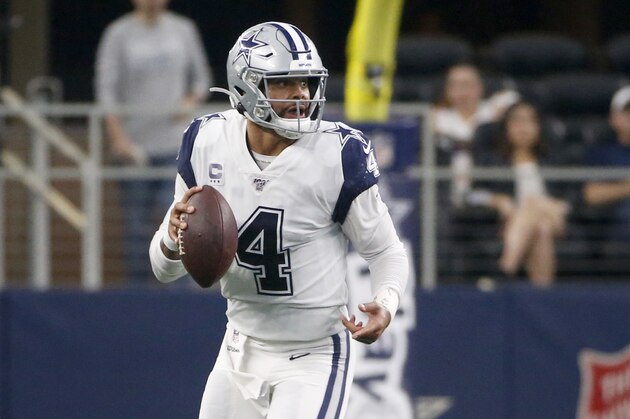 Dallas Cowboys quarterback Dak Prescott (4) scrambles against the Miami Dolphins during the first half of a NFL football game in Arlington, Texas, Sunday, Sept. 22, 2019. (AP Photo/Ron Jenkins)
