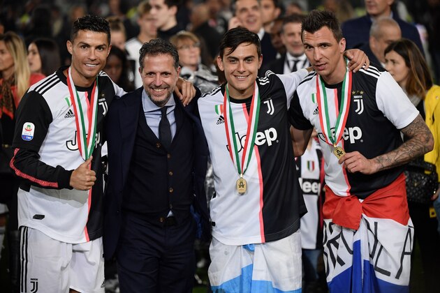 (LtoR) Juventus' Portuguese forward Cristiano Ronaldo, Juventus technical manager Fabio Paratici, Juventus' Argentine forward Paulo Dybala and Juventus' Croatian forward Mario Mandzukic celebrate being crowned Italian champion at the end of the Italian Serie A football match Juventus vs Atalanta on May 19, 2019 at the Allianz stadium in Turin. (Photo by Marco Bertorello / AFP) (Photo credit should read MARCO BERTORELLO/AFP/Getty Images) (LtoR) Juventus' Portuguese forward Cristiano Ronaldo, Juventus technical manager Fabio Paratici, Juventus' Argentine forward Paulo Dybala and Juventus' Croatian forward Mario Mandzukic celebrate being crowned Italian champion at the end of the Italian Serie A football match Juventus vs Atalanta on May 19, 2019 at the Allianz stadium in Turin. (Photo by Marco Bertorello / AFP) (Photo credit should read MARCO BERTORELLO/AFP/Getty Images)