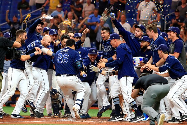 ST PETERSBURG, FLORIDA - SEPTEMBER 24: Ji-Man Choi #26 of the Tampa Bay Rays celebrates a walk off home run in the 12th inning during a game against the New York Yankees at Tropicana Field on September 24, 2019 in St Petersburg, Florida. (Photo by Mike Ehrmann/Getty Images)