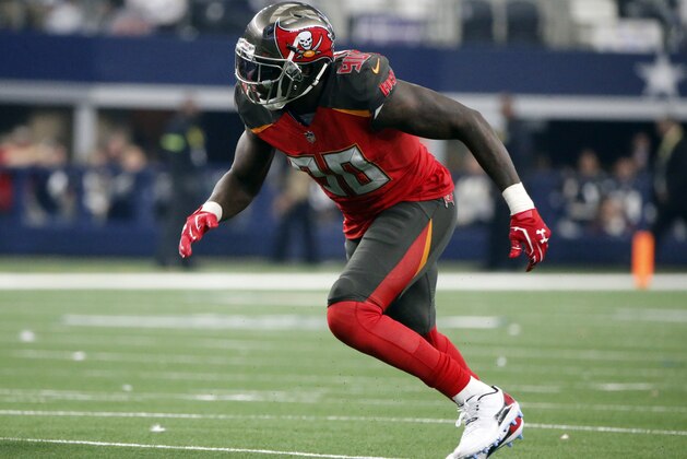 Tampa Bay Buccaneers defensive end Jason Pierre-Paul (90) rushes against the Dallas Cowboys during the second half of an NFL football game in Arlington, Texas, Sunday, Dec. 23, 2018. (AP Photo/Michael Ainsworth)