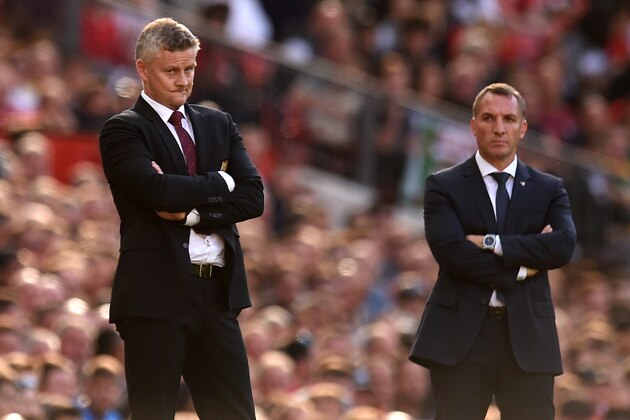 Manchester United's Norwegian manager Ole Gunnar Solskjaer (L) and Leicester City's Northern Irish manager Brendan Rodgers (R) watch from the touchline during the English Premier League football match between Manchester United and Leicester City at Old Trafford in Manchester, north west England, on September 14, 2019. (Photo by Oli SCARFF / AFP) / RESTRICTED TO EDITORIAL USE. No use with unauthorized audio, video, data, fixture lists, club/league logos or 'live' services. Online in-match use limited to 120 images. An additional 40 images may be used in extra time. No video emulation. Social media in-match use limited to 120 images. An additional 40 images may be used in extra time. No use in betting publications, games or single club/league/player publications. /         (Photo credit should read OLI SCARFF/AFP/Getty Images)