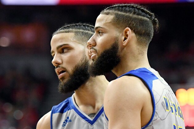 LAS VEGAS, NEVADA - JANUARY 29:  Caleb Martin #10 and Cody Martin #11 of the Nevada Wolf Pack talk on the court during their game against the UNLV Rebels at the Thomas & Mack Center on January 29, 2019 in Las Vegas, Nevada. The Wolf Pack defeated the Rebels 87-70.  (Photo by Ethan Miller/Getty Images)
