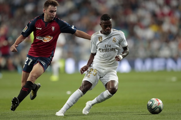 Osasuna's Jon Moncayola fights for the ball against Real Madrid's Vinicius Jr. during the Spanish La Liga soccer match between Real Madrid and Osasuna at the Santiago Bernabeu stadium in Madrid, Spain, Wednesday, Sept. 25, 2019. (AP Photo/Bernat Armangue)