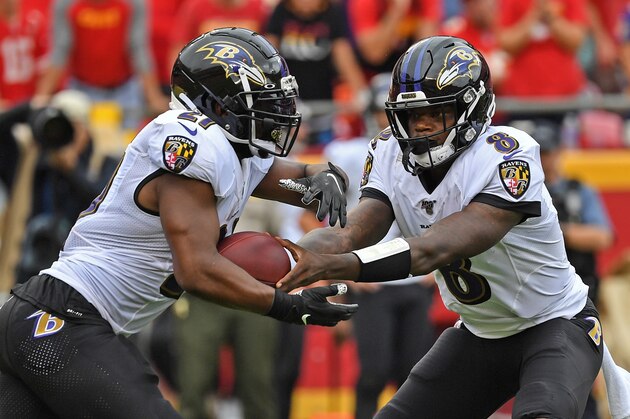 KANSAS CITY, MO - SEPTEMBER 22: Quarterback Lamar Jackson #8 of the Baltimore Ravens hands the ball off to running back Mark Ingram #21 against the Kansas City Chiefs during the first half at Arrowhead Stadium on September 22, 2019 in Kansas City, Missouri. (Photo by Peter G. Aiken/Getty Images) KANSAS CITY, MO - SEPTEMBER 22: Quarterback Lamar Jackson #8 of the Baltimore Ravens hands the ball off to running back Mark Ingram #21 against the Kansas City Chiefs during the first half at Arrowhead Stadium on September 22, 2019 in Kansas City, Missouri. (Photo by Peter G. Aiken/Getty Images)