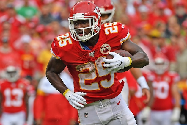 KANSAS CITY, MO - SEPTEMBER 22:  Running back LeSean McCoy #25 of the Kansas City Chiefs rushes up field against strong safety Tony Jefferson #23 of the Baltimore Ravens during the second half at Arrowhead Stadium on September 22, 2019 in Kansas City, Missouri. (Photo by Peter Aiken/Getty Images)