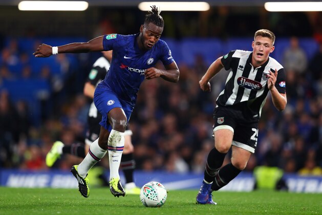 LONDON, ENGLAND - SEPTEMBER 25: Michy Batshuayi of Chelsea controls the ball as Mattie Pollock of Grimsby Town looks on during the Carabao Cup Third Round match between Chelsea FC and Grimsby Town at Stamford Bridge on September 25, 2019 in London, England. (Photo by Dan Istitene/Getty Images)