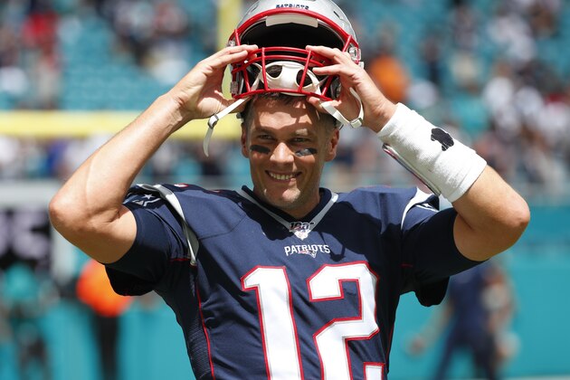 New England Patriots quarterback Tom Brady (12) smiles before an NFL football game against the Miami Dolphins, Sunday, Sept. 15, 2019, in Miami Gardens, Fla. (AP Photo/Wilfredo Lee)