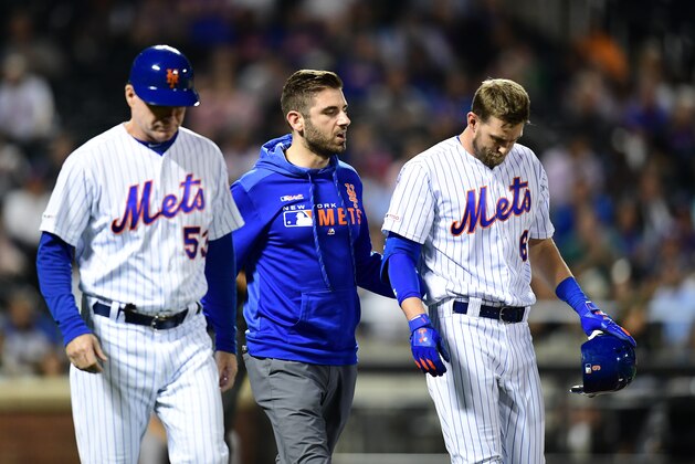 NEW YORK, NEW YORK - SEPTEMBER 25: Jeff McNeil #6 of the New York Mets walks off the field with coaches after being hit with a ball during the sixth inning of their game against the Miami Marlins at Citi Field on September 25, 2019 in the Flushing neighborhood of the Queens borough in New York City. (Photo by Emilee Chinn/Getty Images)