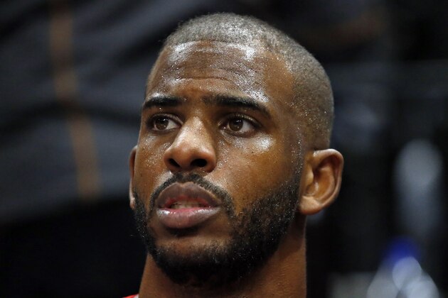 Houston Rockets guard Chris Paul sits on the bench in the second half during an NBA basketball game against the Utah Jazz Saturday, April 20, 2019, in Salt Lake City. (AP Photo/Rick Bowmer)