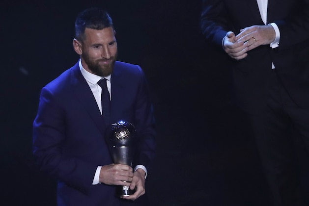 Argentinian Barcelona player Lionel Messi receives the Best FIFA mens player award during the ceremony of the Best FIFA Football Awards, in Milan's La Scala theater, northern Italy, Monday, Sept. 23, 2019. (AP Photo/Antonio Calanni)