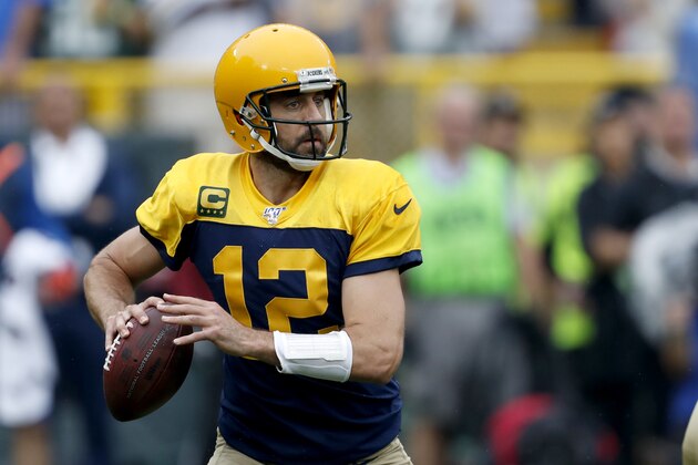 Green Bay Packers quarterback Aaron Rodgers drops back to pass during the first half of an NFL football game against the Denver Broncos, Sunday, Sept. 22, 2019, in Green Bay, Wis. (AP Photo/Matt Ludtke)