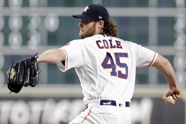 Houston Astros starting pitcher Gerrit Cole (45) throws against the Texas Rangers during the first inning of a baseball game Wednesday, Sept. 18, 2019, in Houston. (AP Photo/Michael Wyke)