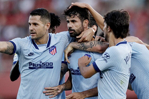 MALLORCA, SPAIN - SEPTEMBER 25: Diego Costa of Atletico Madrid celebrates 0-1 with Vitolo of Atletico Madrid, Joao Felix of Atletico Madrid  during the La Liga Santander  match between Real Mallorca v Atletico Madrid at the Iberostar Stadium on September 25, 2019 in Mallorca Spain (Photo by Rico Brouwer/Soccrates/Getty Images)