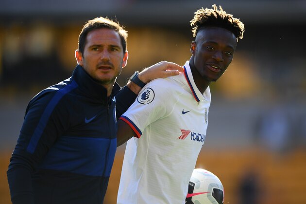 WOLVERHAMPTON, ENGLAND - SEPTEMBER 14: Tammy Abraham of Chelsea with the match ball and his manager Frank Lampard after his hatrick following the the Premier League match between Wolverhampton Wanderers and Chelsea FC at Molineux on September 14, 2019 in Wolverhampton, United Kingdom. (Photo by Clive Mason/Getty Images)
