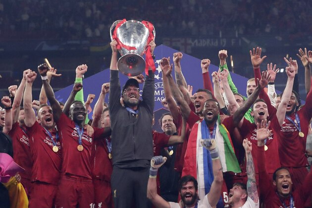 Liverpool coach Juergen Klopp lifts the trophy after winning the Champions League final soccer match between Tottenham Hotspur and Liverpool at the Wanda Metropolitano Stadium in Madrid, Saturday, June 1, 2019. (AP Photo/Manu Fernandez)