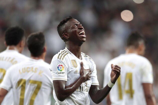 Real Madrid's Vinicius Jr. celebrates scoring the opening goal during the Spanish La Liga soccer match between Real Madrid and Osasuna at the Santiago Bernabeu stadium in Madrid, Spain, Wednesday, Sept. 25, 2019. (AP Photo/Bernat Armangue)
