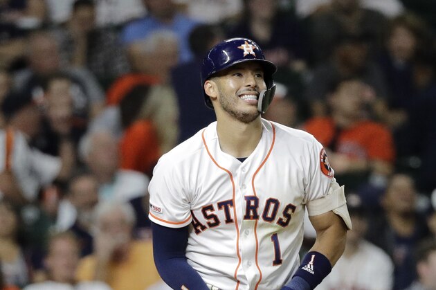 Houston Astros' Carlos Correa reacts after striking out against the Texas Rangers during the eighth inning of a baseball game Tuesday, Sept. 17, 2019, in Houston. (AP Photo/David J. Phillip)