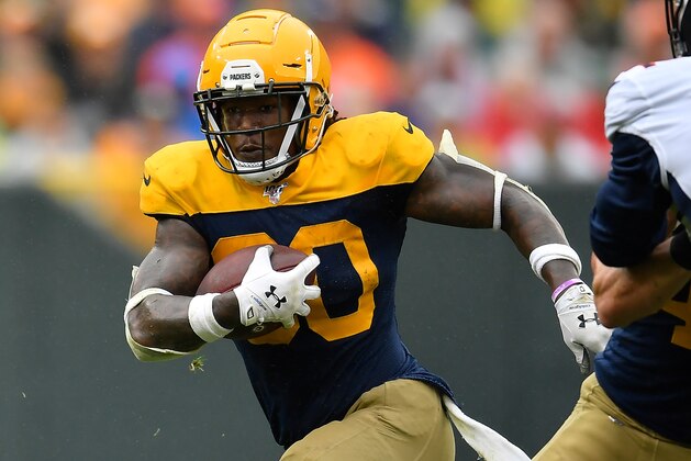 GREEN BAY, WISCONSIN - SEPTEMBER 22: Jamaal Williams #30 of the Green Bay Packers runs with the football against the Denver Broncos at Lambeau Field on September 22, 2019 in Green Bay, Wisconsin. (Photo by Quinn Harris/Getty Images)