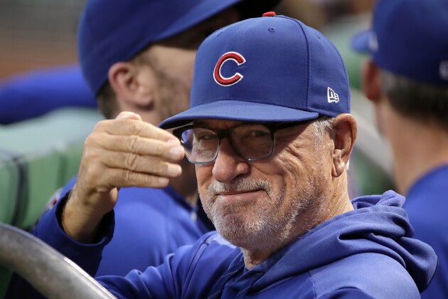 Chicago Cubs manager Joe Maddon acknowledges a fan before a baseball game against the Pittsburgh Pirates in Pittsburgh, Thursday, Sept. 26, 2019. (AP Photo/Gene J. Puskar)