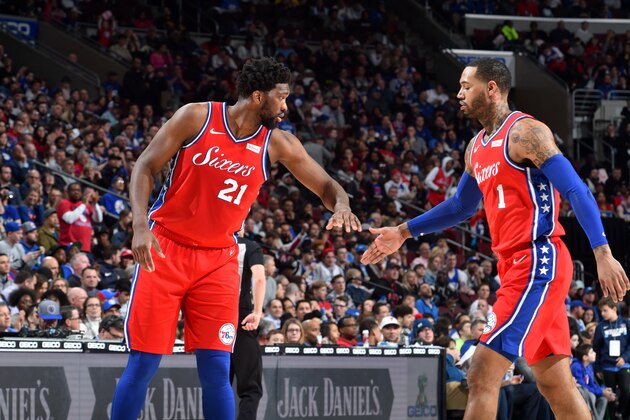 PHILADELPHIA, PA - MARCH 12: Joel Embiid #21 and Mike Scott #1 of the Philadelphia 76ers high five during the game against the Cleveland Cavaliers on March 12, 2019 at the Wells Fargo Center in Philadelphia, Pennsylvania. NOTE TO USER: User expressly acknowledges and agrees that, by downloading and/or using this photograph, user is consenting to the terms and conditions of the Getty Images License Agreement. Mandatory Copyright Notice: Copyright 2019 NBAE (Photo by Jesse D. Garrabrant/NBAE via Getty Images)