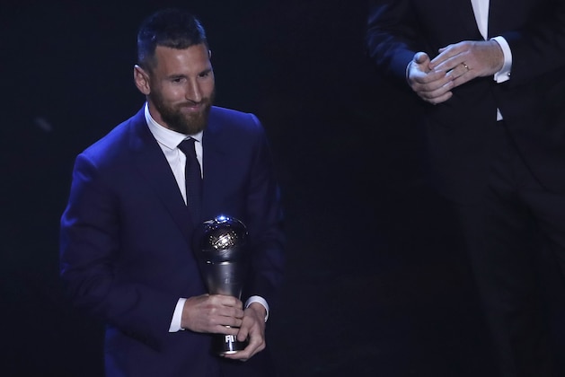 Argentinian Barcelona player Lionel Messi receives the Best FIFA mens player award during the ceremony of the Best FIFA Football Awards, in Milan's La Scala theater, northern Italy, Monday, Sept. 23, 2019. (AP Photo/Antonio Calanni)