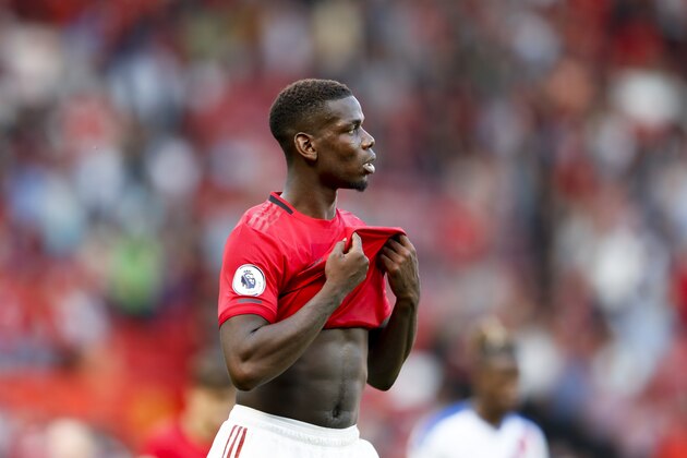 Manchester United's Paul Pogba leaves the pitch at the end of the English Premier League soccer match between Manchester United and Crystal Palace at Old Trafford in Manchester, England Saturday, Aug, 24, 2019. (AP Photo/Alastair Grant)