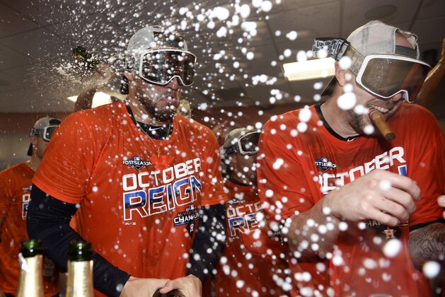 Houston Astros' George Springer, left, and Ryan Pressly celebrate their clinching of the AL West crown after a baseball game against the Los Angeles Angels, Sunday, Sept. 22, 2019, in Houston. (AP Photo/Eric Christian Smith) Houston Astros' George Springer, left, and Ryan Pressly celebrate their clinching of the AL West crown after a baseball game against the Los Angeles Angels, Sunday, Sept. 22, 2019, in Houston. (AP Photo/Eric Christian Smith)