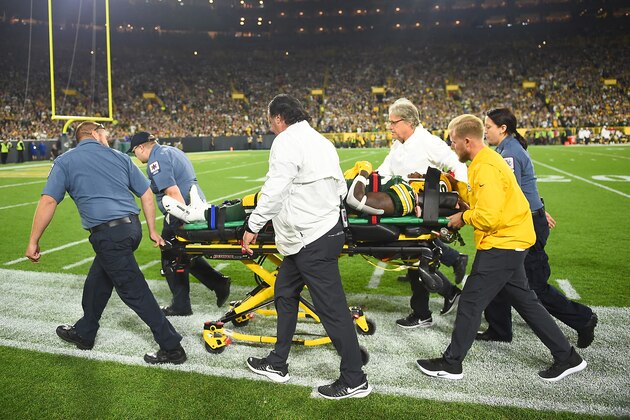 GREEN BAY, WISCONSIN - SEPTEMBER 26: Running back Jamaal Williams #30 of the Green Bay Packers is taken out on a stretcher after helmet-to-helmet hit by the defense of the Philadelphia Eagles during the first quarter of the game at Lambeau Field on September 26, 2019 in Green Bay, Wisconsin. (Photo by Stacy Revere/Getty Images)