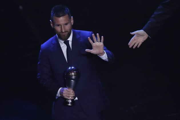 Argentinian Barcelona player Lionel Messi receives the Best FIFA mens player award during the ceremony of the Best FIFA Football Awards, in Milan's La Scala theater, northern Italy, Monday, Sept. 23, 2019. (AP Photo/Antonio Calanni)