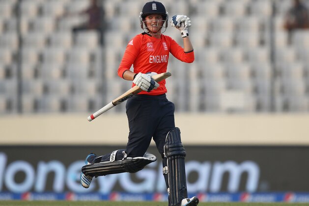 England's Sarah Taylor celebrates their win over South Africa in the ICC Women's Twenty20 Cricket World Cup semi-final match in Dhaka, Bangladesh, Friday, April 4, 2014. England won the match by nine wickets. (AP Photo/Aijaz Rahi)