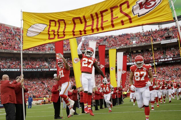 Kansas City Chiefs running back Darrel Williams (31), defensive back Rashad Fenton (27) and Kansas City Chiefs tight end Travis Kelce (87) run onto the field before an NFL football game against the Baltimore Ravens Sunday, Sept. 22, 2019, in Kansas City, Mo. (AP Photo/Charlie Riedel)