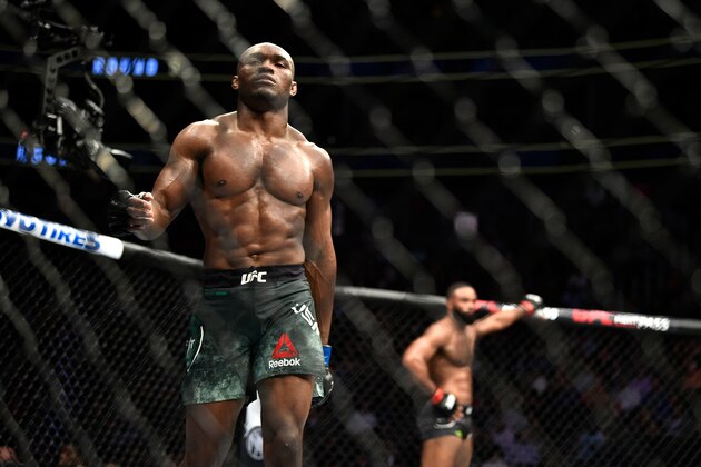 LAS VEGAS, NEVADA - MARCH 02:  (L-R) Kamaru Usman of Nigeria walks back to his corner after a round of his welterweight championship bout against Tyron Woodley during the UFC 235 event at T-Mobile Arena on March 2, 2019 in Las Vegas, Nevada. (Photo by Chris Unger/Zuffa LLC/Zuffa LLC via Getty Images)