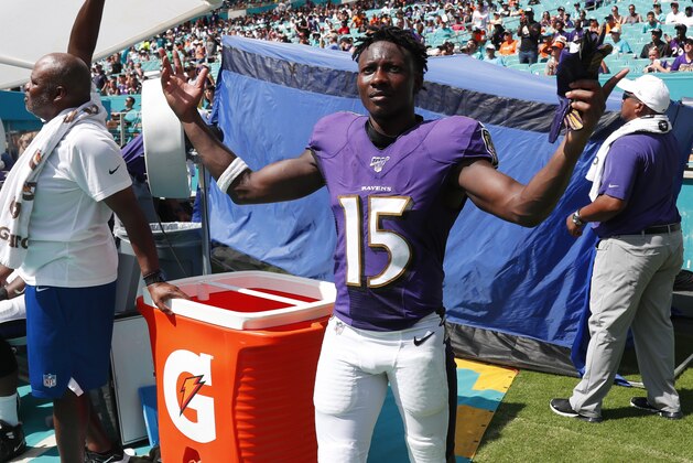 Baltimore Ravens wide receiver Marquise Brown (15) gestures during the last minutes of the second half at an NFL football game against the Miami Dolphins, Sunday, Sept. 8, 2019, in Miami Gardens, Fla. The Ravens defeated the Dolphins 59-10. (AP Photo/Wilfredo Lee)